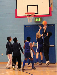 Mini-Basketball players taking a shot